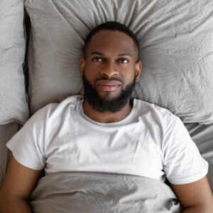 Man in bed with no interest because of depression - get help from Wyndhurst Counseling and Wellness