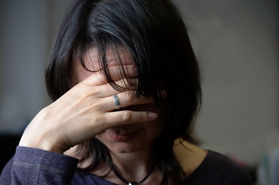 Woman with head in hands knows she need Depression Counseling from Wyndhurst Counseling Center