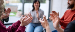 Group of diverse people clapping