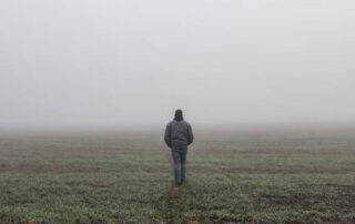 Man walking into the fog feeling very alone but need support from Wyndhurst Counseling and Wellness 600