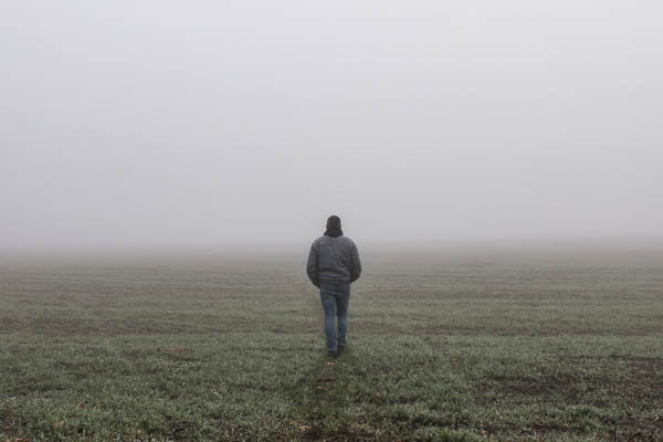 Man walking into the fog feeling very alone but need support from Wyndhurst Counseling and Wellness 600
