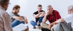 Men in group therapy session Wyndhurst Counseling and Wellness