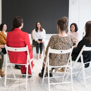 Women sitting in a circle supporting each other in a substance abuse group