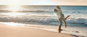 Couple on beach loving life after taking Intensive counseling at Wyndhurst Counseling and Wellness